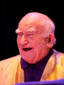 Ed Asner portrays God – a wise, cantankerous and wildly funny deity. 