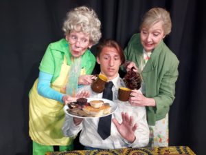 Cast members in Port Polson Players’ production of “Over the River and Through the Woods” include Kia McDonald (center) as Nick, and his two grandmothers, Karen Lewing as Aida and Ann Peacock as Emma.