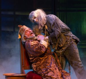 Ebenezer Scrooge confronts another ghost in A Christmas Carol. 