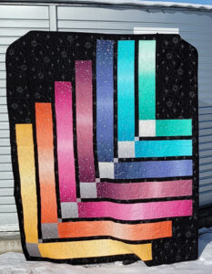 Starburst Ombre Quilt by Stacia Moore, who is one of the quilters at the Mountain Brook Craft Cooperative's market. 
