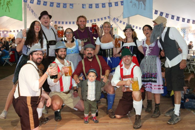 A gang of Oktoberfest enthusiasts hoists a toast at last year's event. 