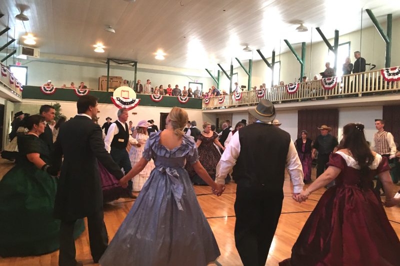 Dancers in period attire circle the floor at the Virginia City Grand Victorian Ball. 