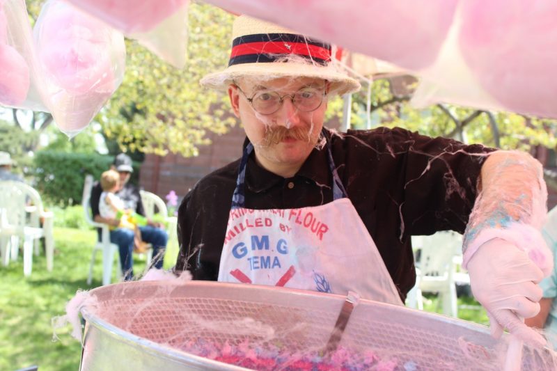 Cotton candy vendor prepares his wares at the Moss Mansion's SpringFest.