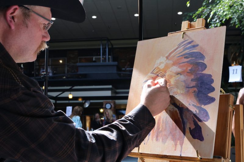 Accomplished painter Tim Joyner at work during the Out West Art Show. 