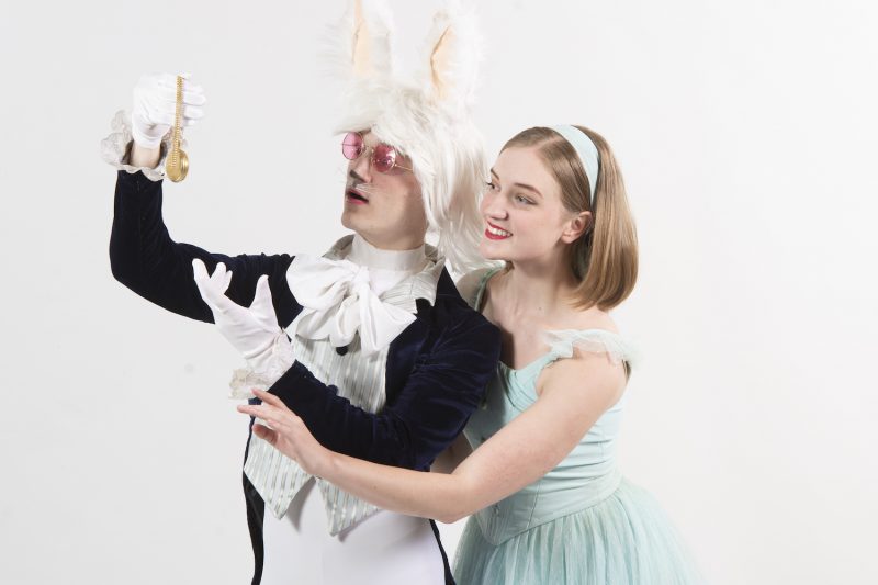 The White Rabbit (Sam Stutz) and Alice (Elinor Goehring)  prepare for adventure in Queen City Ballet's Alice in Wonderland. 