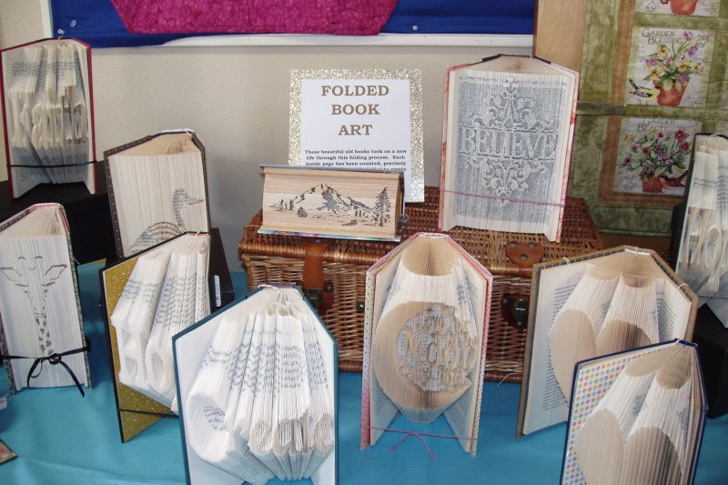 Folded book art by Beth Hansen will be on display at the Quilt & Craft Market. 